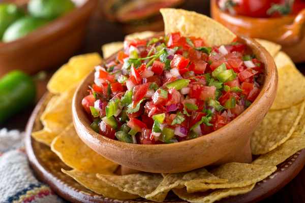A bowl of pico de gallo with chips